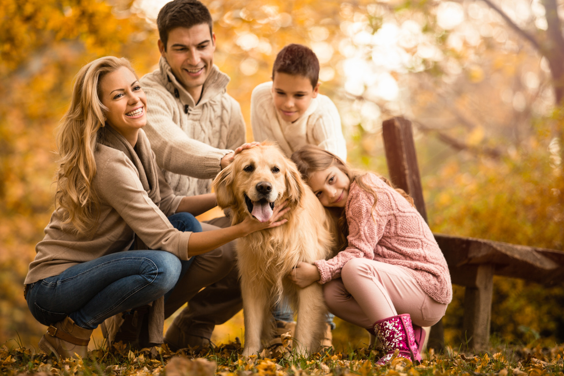 Happy Family And Dog In Autumn